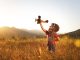 Boy playing with toy aeroplane