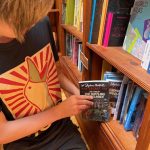 Taking book from shelf