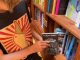 Taking book from shelf