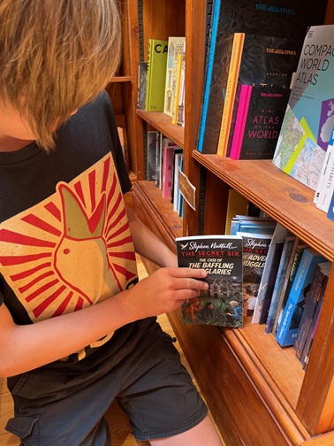 Taking book from shelf